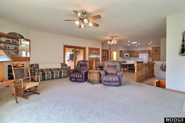 carpeted living area with recessed lighting, baseboards, and a ceiling fan