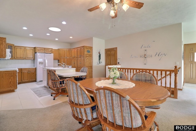 dining area featuring light carpet, recessed lighting, light tile patterned flooring, and ceiling fan