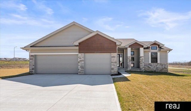 craftsman inspired home featuring a garage, driveway, stone siding, and a front lawn
