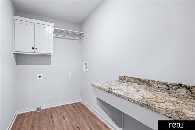 washroom featuring light wood-style flooring, washer hookup, baseboards, and electric dryer hookup