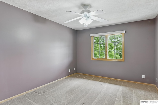 6520 N 157th St, Omaha, NE 68116 - unfurnished room featuring a ceiling fan, carpet, and a textured ceiling