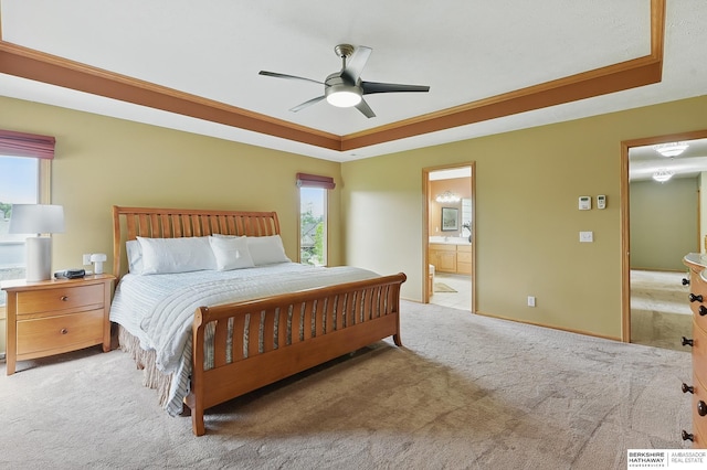 6520 N 157th St, Omaha, NE 68116 - carpeted bedroom featuring a raised ceiling, connected bathroom, and a ceiling fan
