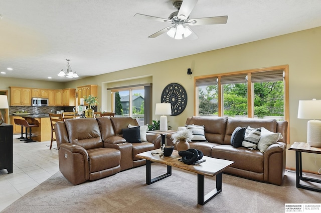6520 N 157th St, Omaha, NE 68116 - living area featuring a chandelier, a ceiling fan, light tile patterned flooring, and recessed lighting