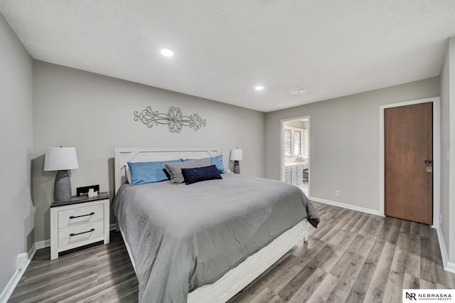 bedroom with recessed lighting, baseboards, and wood finished floors