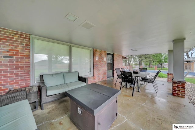 view of patio / terrace featuring an outdoor living space and outdoor dining area