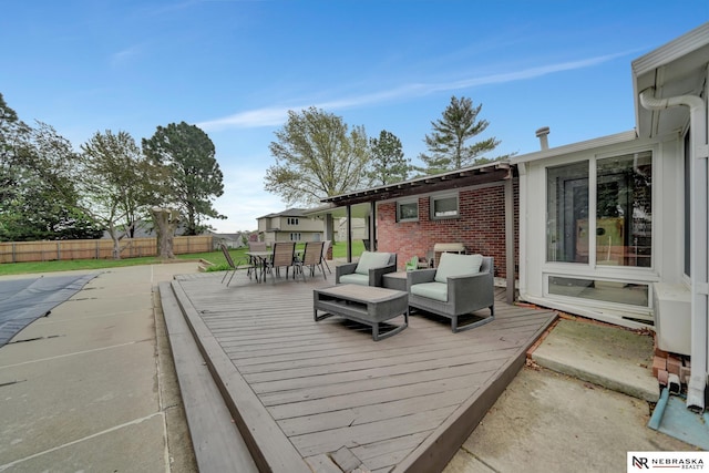 wooden deck with outdoor dining area and fence