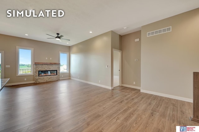 10551 Majestic Ln, Lincoln, NE 68527 - unfurnished living room featuring light wood-style floors, baseboards, and visible vents