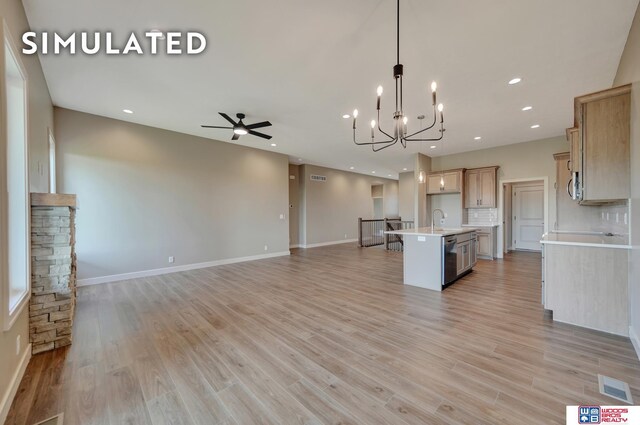 10551 Majestic Ln, Lincoln, NE 68527 - kitchen with visible vents, a sink, light countertops, stainless steel appliances, and open floor plan