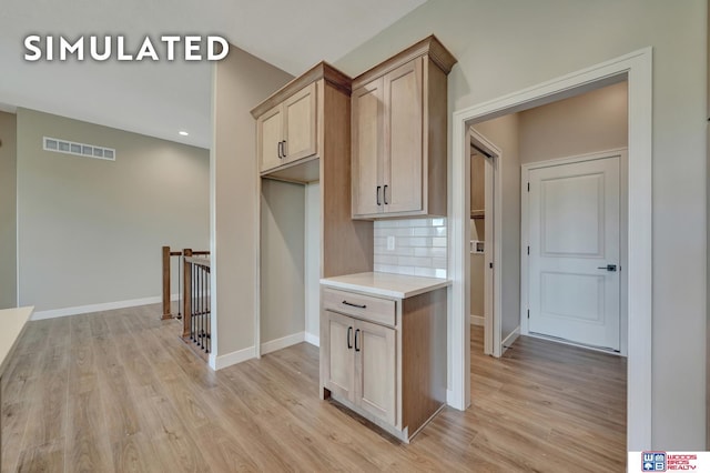 10551 Majestic Ln, Lincoln, NE 68527 - corridor with light wood-type flooring, an upstairs landing, baseboards, and visible vents
