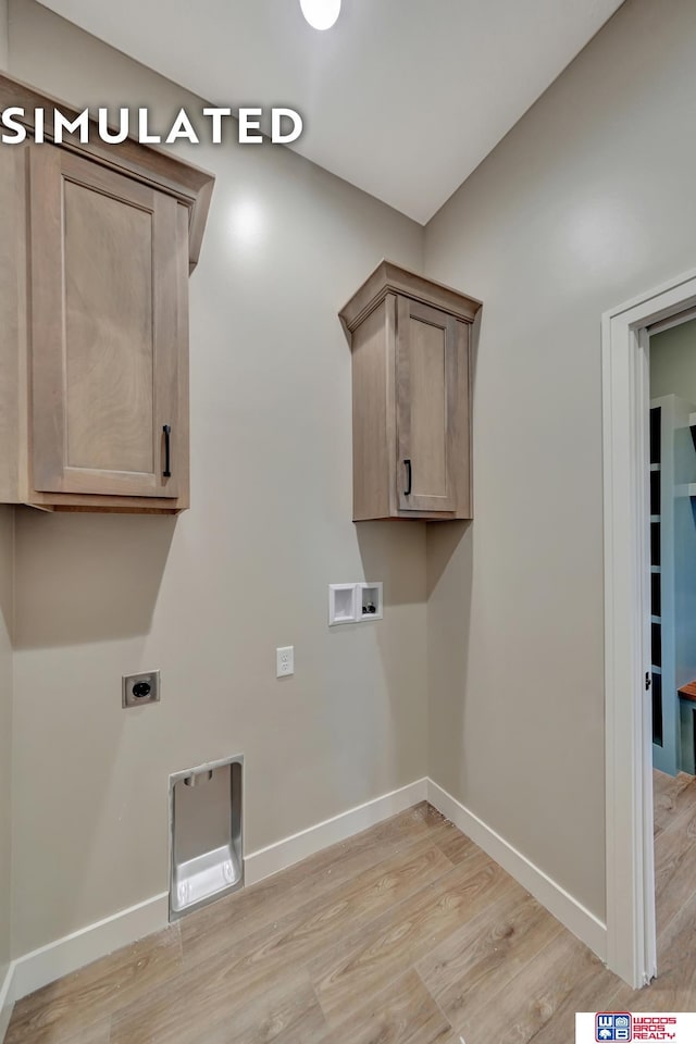 10551 Majestic Ln, Lincoln, NE 68527 - laundry room featuring cabinet space, baseboards, electric dryer hookup, and washer hookup