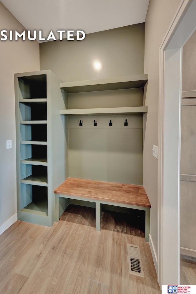 10551 Majestic Ln, Lincoln, NE 68527 - mudroom with visible vents, baseboards, and wood finished floors
