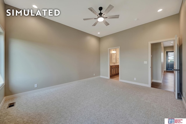 10551 Majestic Ln, Lincoln, NE 68527 - unfurnished bedroom with visible vents, baseboards, ensuite bathroom, carpet floors, and recessed lighting
