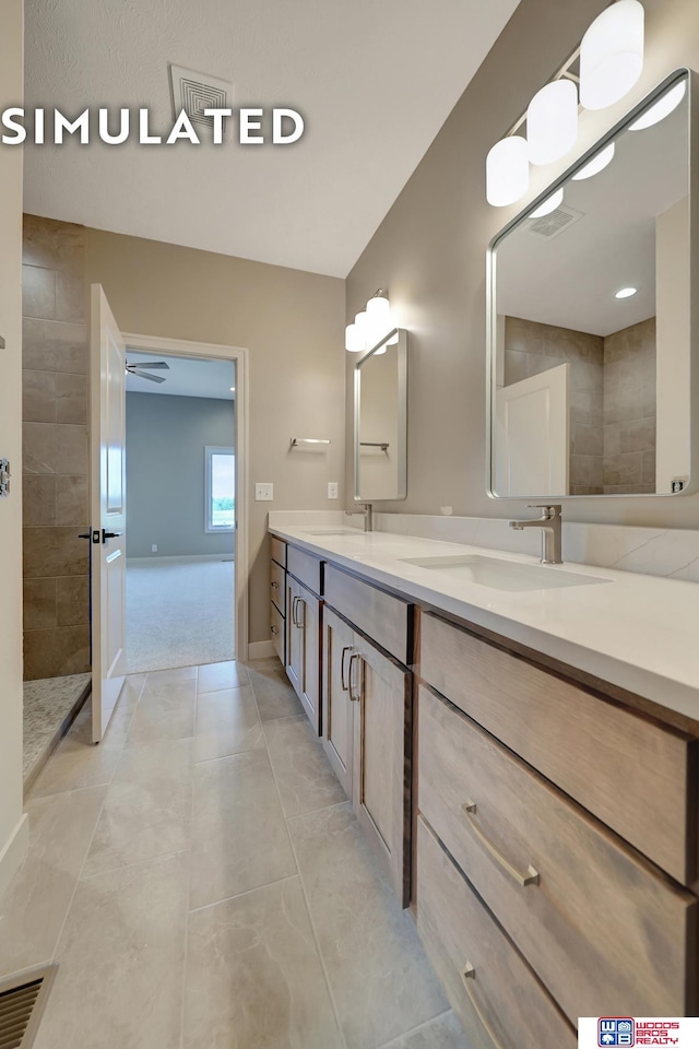 10551 Majestic Ln, Lincoln, NE 68527 - bathroom featuring a walk in shower, double vanity, visible vents, and a sink