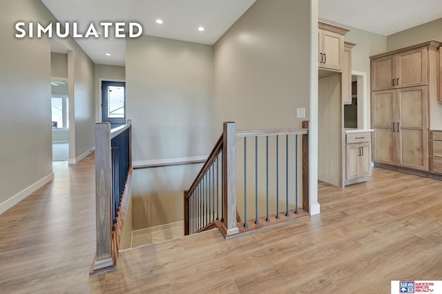 10551 Majestic Ln, Lincoln, NE 68527 - staircase featuring recessed lighting, baseboards, and wood finished floors