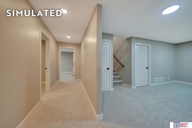 10551 Majestic Ln, Lincoln, NE 68527 - hallway featuring baseboards, visible vents, and carpet floors