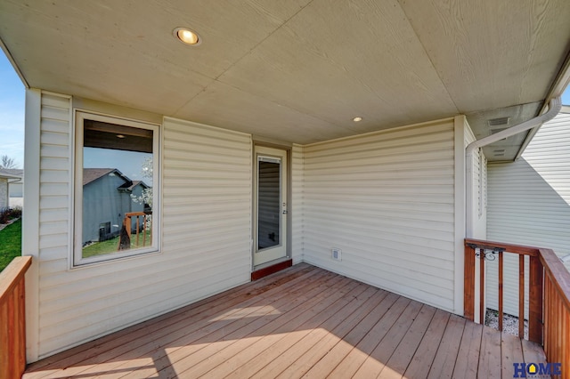 wooden deck with visible vents