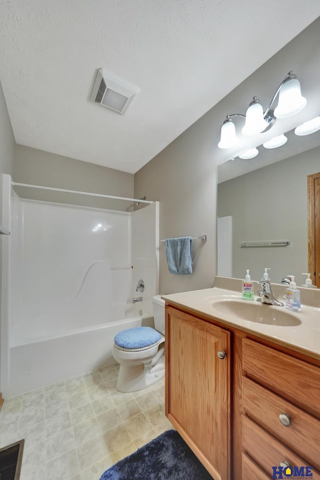bathroom with vanity, visible vents, shower / bathing tub combination, and toilet