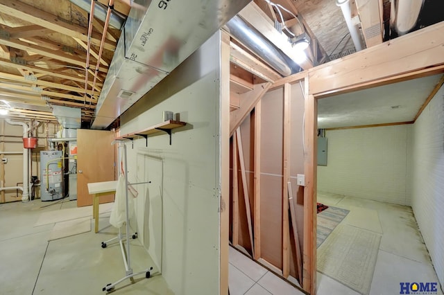 unfinished below grade area with electric panel and water heater