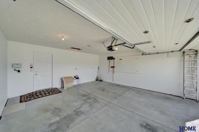 garage featuring a garage door opener