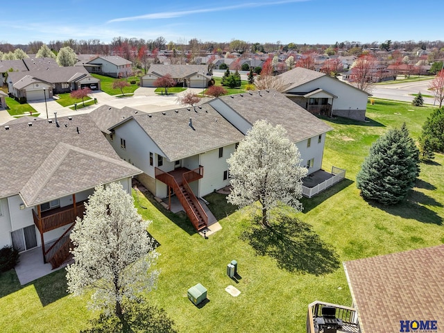 birds eye view of property with a residential view