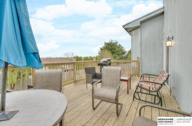 wooden deck with outdoor dining space