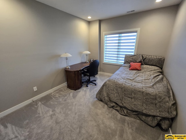 carpeted bedroom with visible vents, baseboards, and recessed lighting