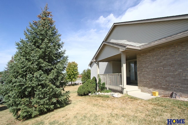 view of yard featuring covered porch