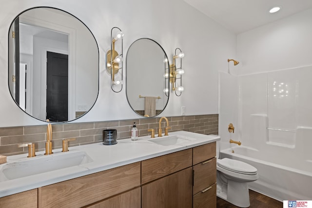676 Waterford Pointe Pointe, Ashland, NE 68003 - full bath featuring toilet, bathtub / shower combination, double vanity, and tasteful backsplash