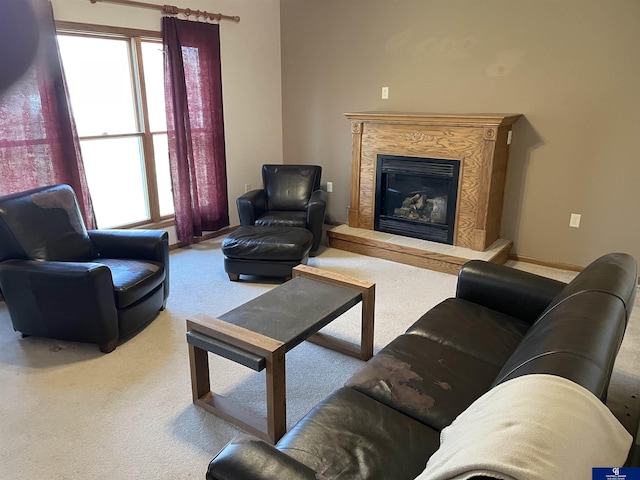 carpeted living area with a wealth of natural light and a premium fireplace