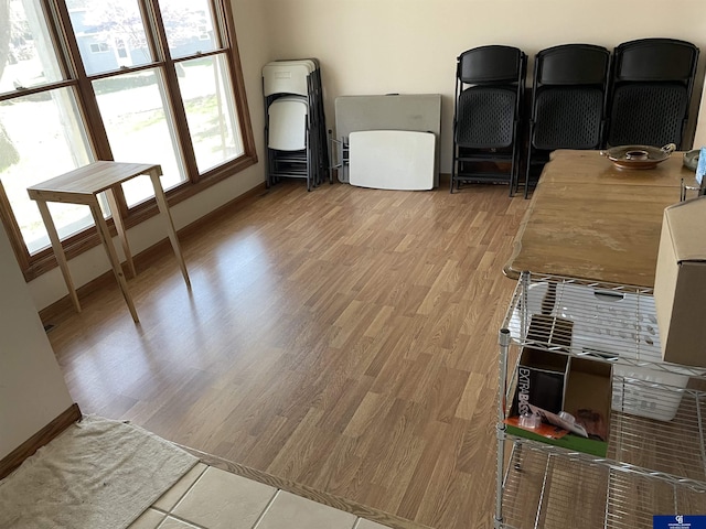 interior space with light wood finished floors and baseboards