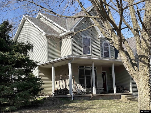 view of front of home featuring roof with shingles