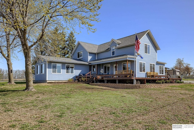 back of house featuring a lawn