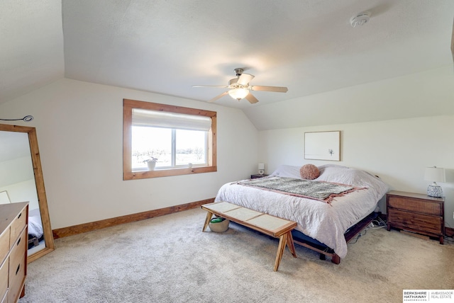 carpeted bedroom with baseboards, a ceiling fan, and lofted ceiling
