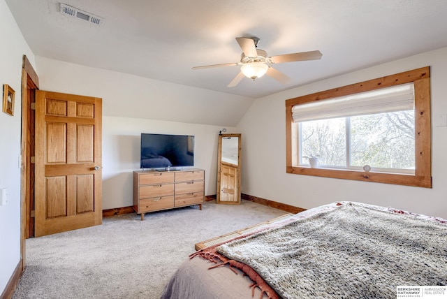 bedroom featuring visible vents, baseboards, ceiling fan, light carpet, and lofted ceiling