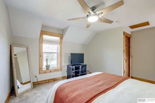 carpeted bedroom featuring visible vents, baseboards, ceiling fan, and vaulted ceiling