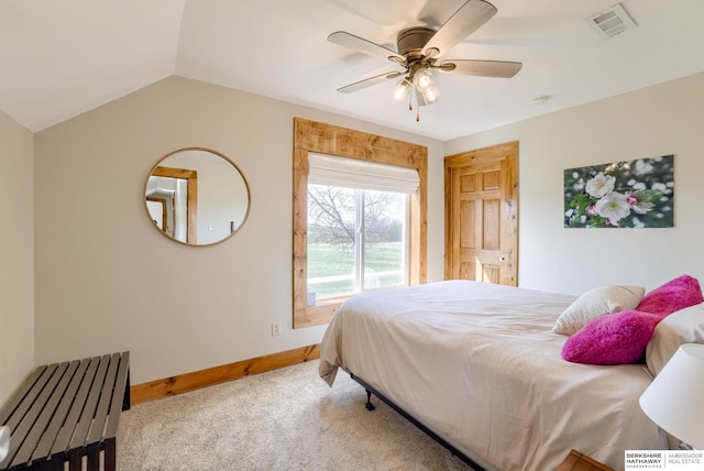 bedroom featuring a ceiling fan, vaulted ceiling, visible vents, carpet floors, and baseboards