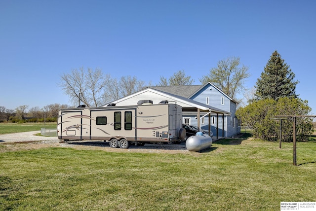 view of property exterior with a lawn