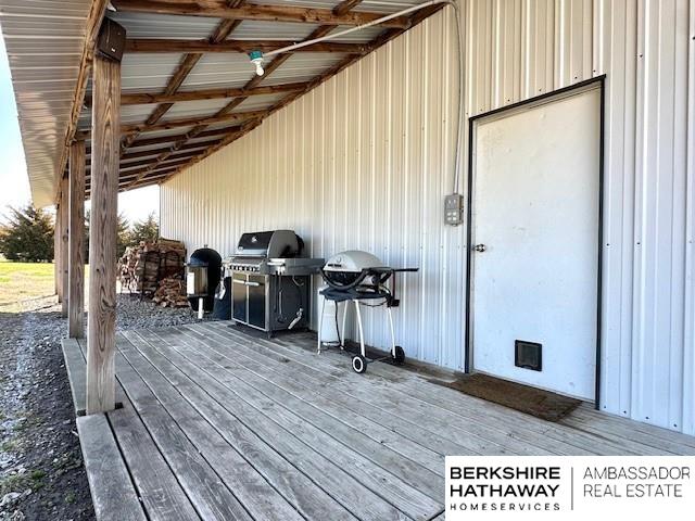 wooden deck featuring area for grilling
