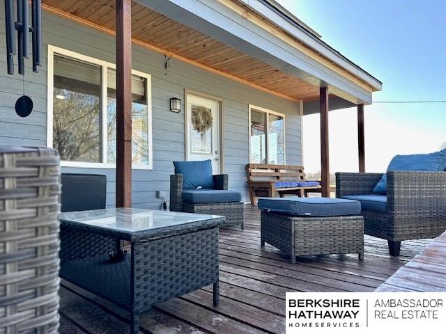 wooden deck featuring an outdoor living space