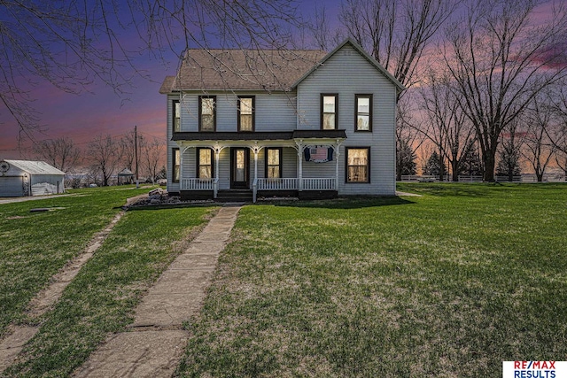 2860 335th St, Logan, IA 51546 - view of front of home with covered porch and a lawn