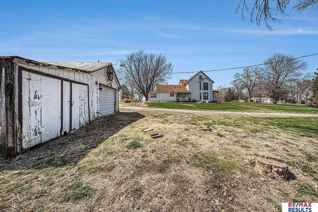 2860 335th St, Logan, IA 51546 - view of yard featuring an outdoor structure and a garage