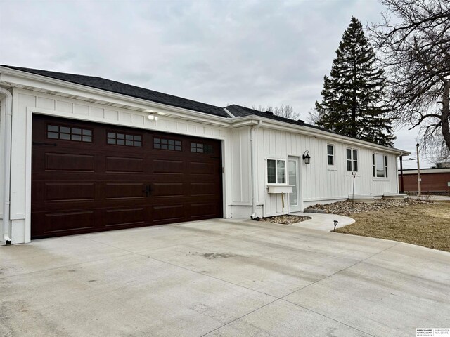 161 S Linden St, Wahoo, NE 68066 - view of front of property with concrete driveway, board and batten siding, and an attached garage