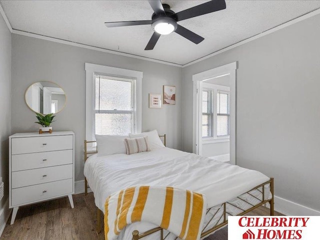 3361 N 59th St, Omaha, NE 68104 - bedroom with multiple windows, crown molding, a ceiling fan, and wood finished floors