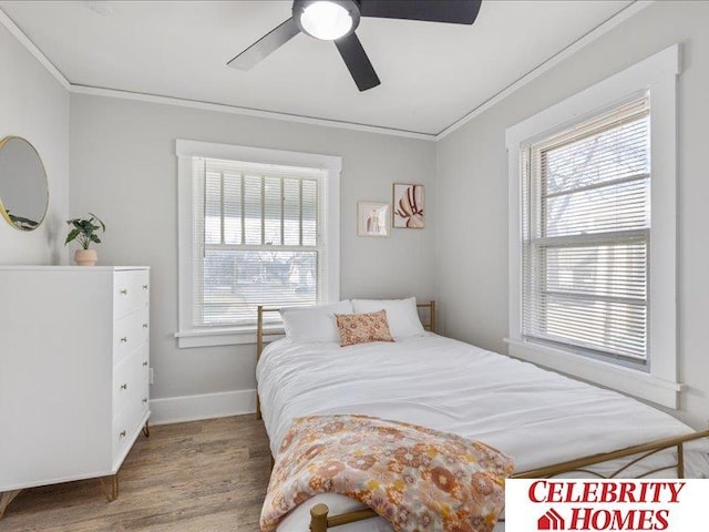 3361 N 59th St, Omaha, NE 68104 - bedroom with ceiling fan, baseboards, ornamental molding, and wood finished floors