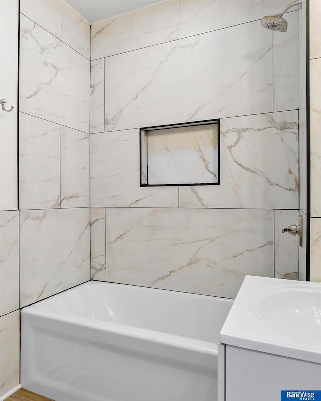 bathroom featuring shower / bathing tub combination and vanity