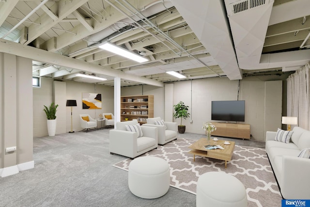 living area with visible vents and carpet floors