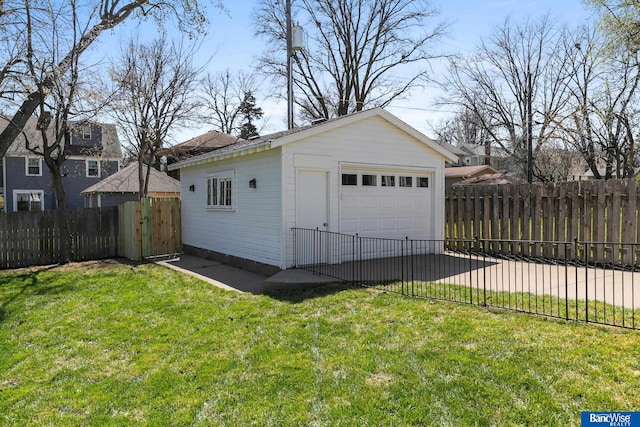 detached garage featuring fence