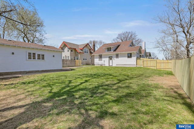 view of yard with a fenced backyard