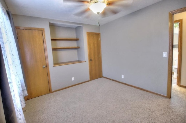 unfurnished bedroom featuring baseboards, ceiling fan, carpet floors, and a closet