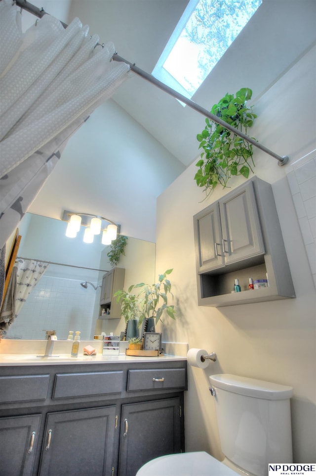 bathroom featuring walk in shower, toilet, high vaulted ceiling, and vanity